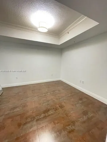 an empty room with a hard wood floor