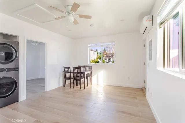 a view of a livingroom with furniture and a kitchen