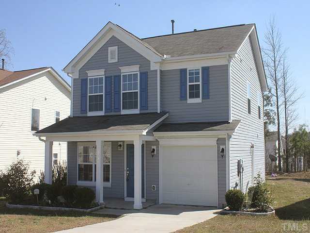 3734 Marshlane Way Raleigh, NC 27610 - Photo 1 of 12 a front view of a house with a yard