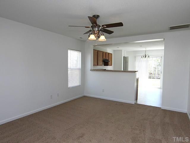 3734 Marshlane Way Raleigh, NC 27610 - Photo 2 of 12 a view of a livingroom with a ceiling fan and window