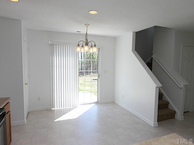 3734 Marshlane Way Raleigh, NC 27610 - Photo 5 of 12 a view of an empty room with a window