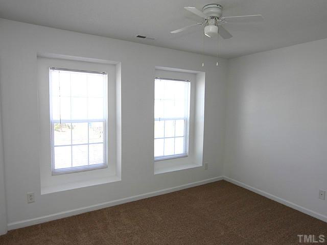 3734 Marshlane Way Raleigh, NC 27610 - Photo 6 of 12 an empty room with a window