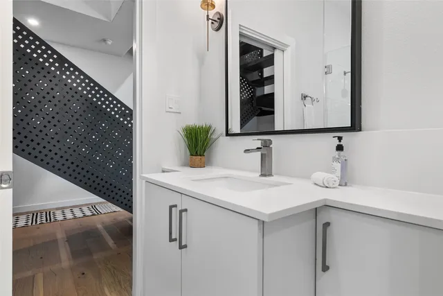 a bathroom with a sink and a mirror