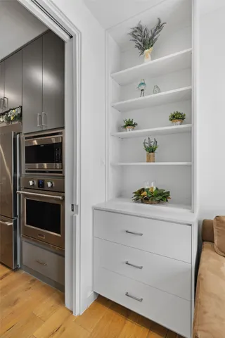 a kitchen with a refrigerator and cabinets