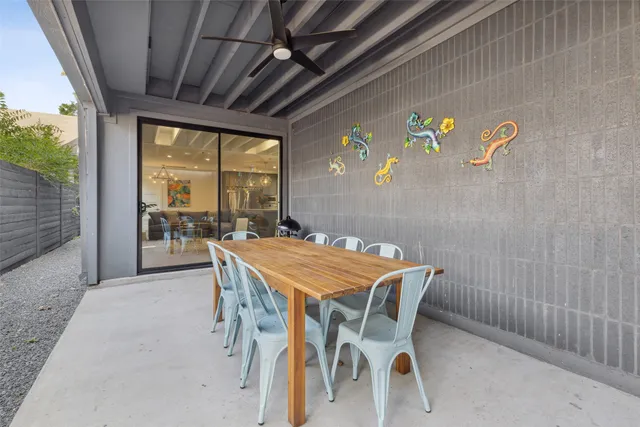 a dining room with a table and chairs