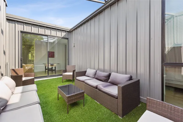 a patio with table and chairs
