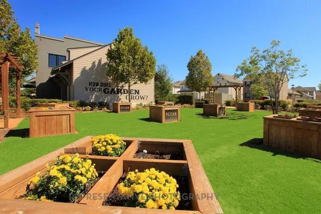 a view of yard with swimming pool outdoor seating and green space