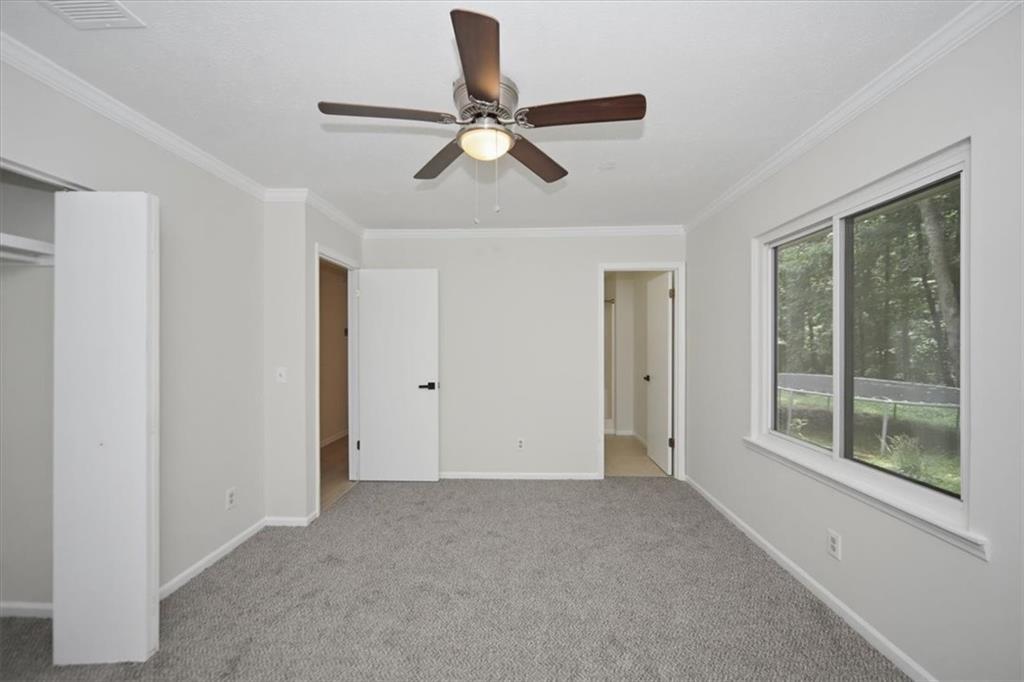 142 Deer Run Canton, GA 30114 - Photo 9 of 24 a view of room with ceiling fan