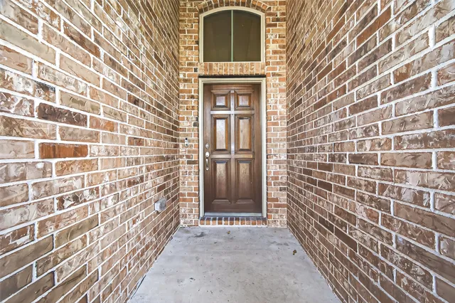 front view of a brick house with a door