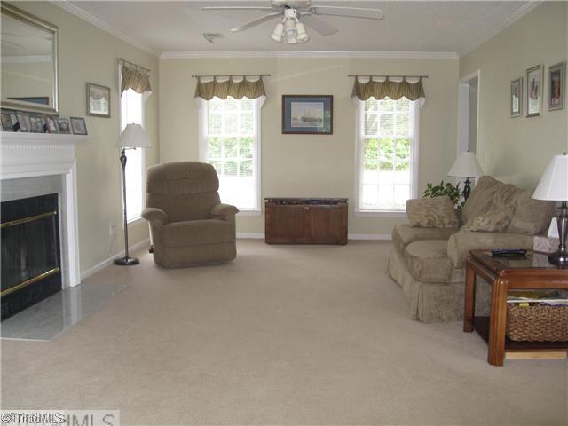 4225 Braddock Road High Point, NC 27265 - Photo 2 of 16 Living Room. Large living room has a wood burning fireplace, eyeball lights, crown moulding, ceiling fan, lots of windows, and french doors to access the patio.
