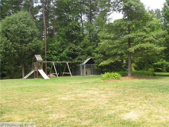 4225 Braddock Road High Point, NC 27265 - Photo 15 of 16 Exterior Back. View from the patio showing the nice depth to the yard.