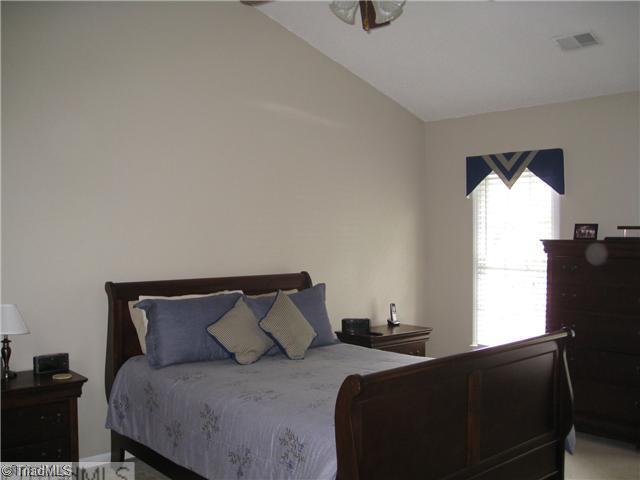 4225 Braddock Road High Point, NC 27265 - Photo 6 of 16 Master Bedroom. The master suite is quite dramatic. Nice in size and the vaulted ceiling gives it a airy and inviting feel.