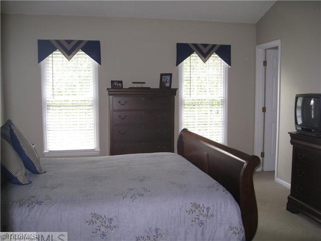 4225 Braddock Road High Point, NC 27265 - Photo 7 of 16 Master Bedroom. The master bedroom has a walk-in closet, ceiling fan, plant shelf, and 2" blinds.