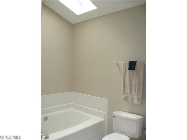 4225 Braddock Road High Point, NC 27265 - Photo 9 of 16 Master Bath/Spa. Great natural light in the master bath provided by the skylight over the soaking tub.