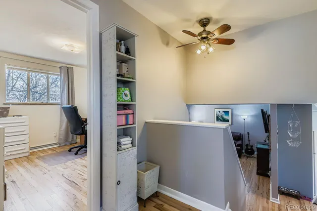 a view of livingroom with furniture and workspace