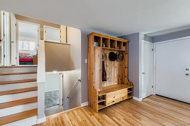 a view of a room with wooden floor and white walls