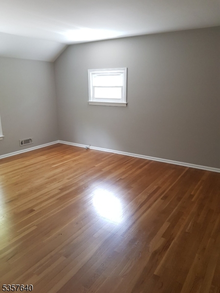 67 Canfield Road Morristown, NJ 07960 - Photo 11 of 21 an empty room with wooden floor and windows