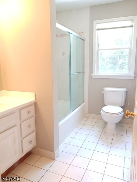 67 Canfield Road Morristown, NJ 07960 - Photo 15 of 21 a bathroom with a toilet a sink and a window