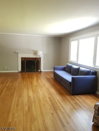 an empty room with wooden floor