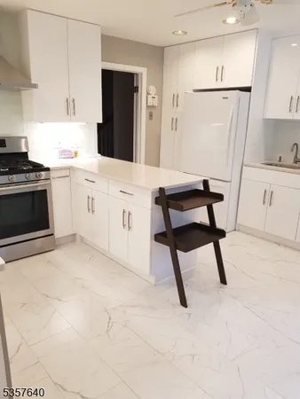 a kitchen with cabinets and white appliances
