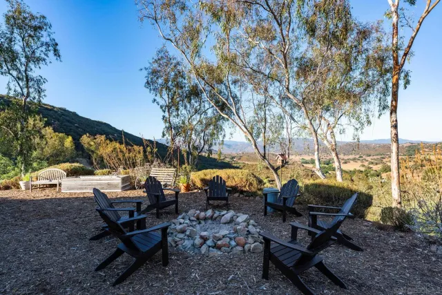 a view of a backyard with sitting area
