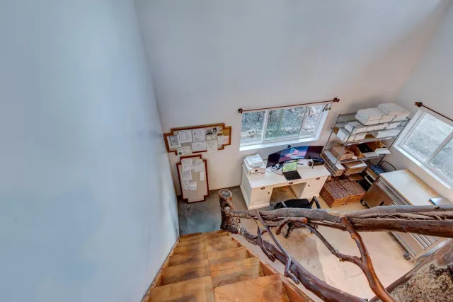 a living room with furniture and a rug