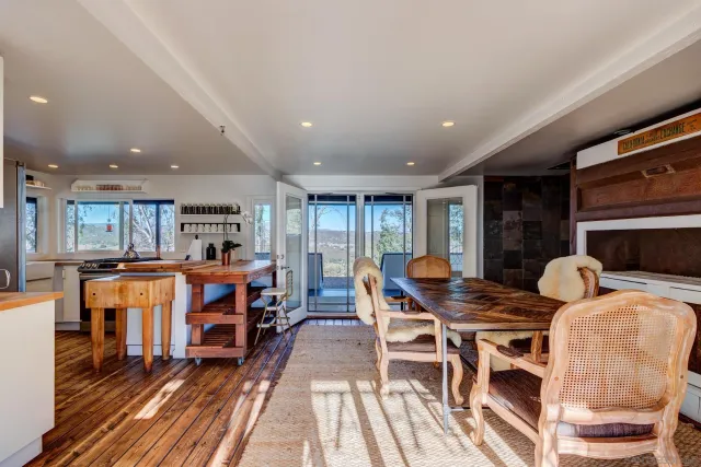 a outdoor dining space with furniture and kitchen view