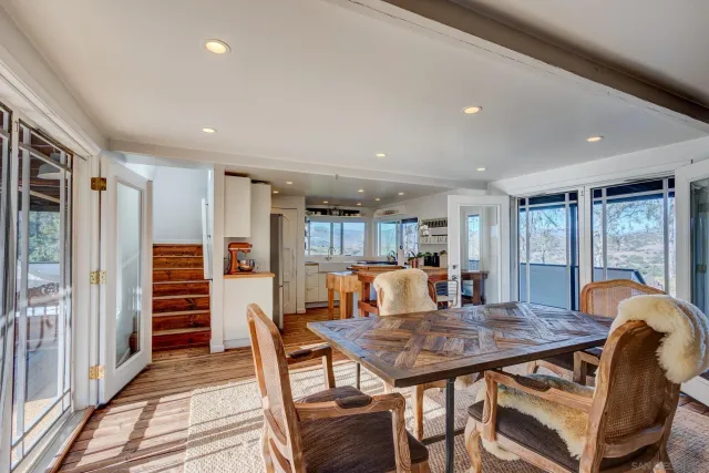 a dining room with furniture and window