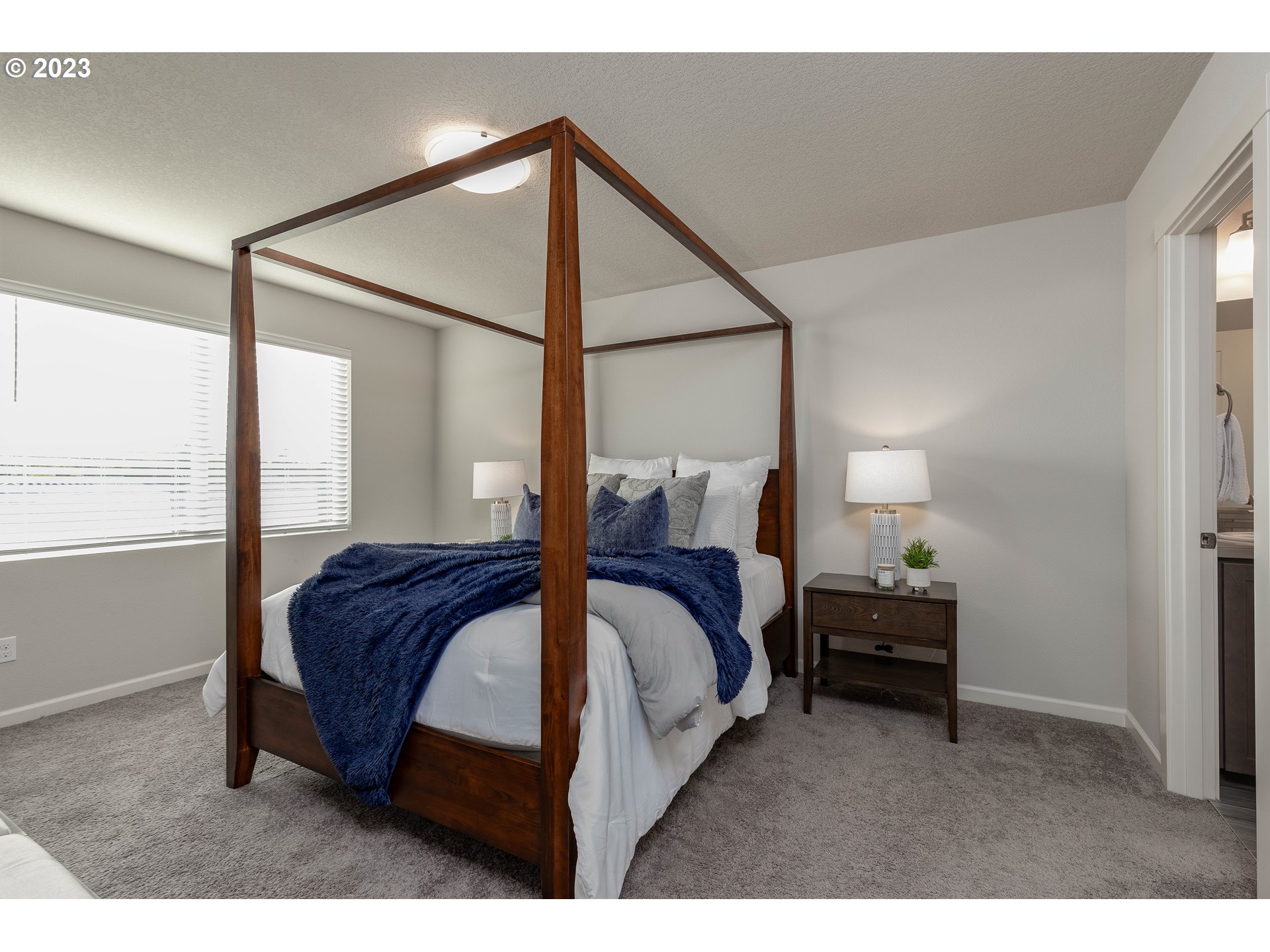 3825 South 39th Place Ridgefield, WA 98642 - Photo 23 of 37 a spacious bedroom with a bed window and a mirror