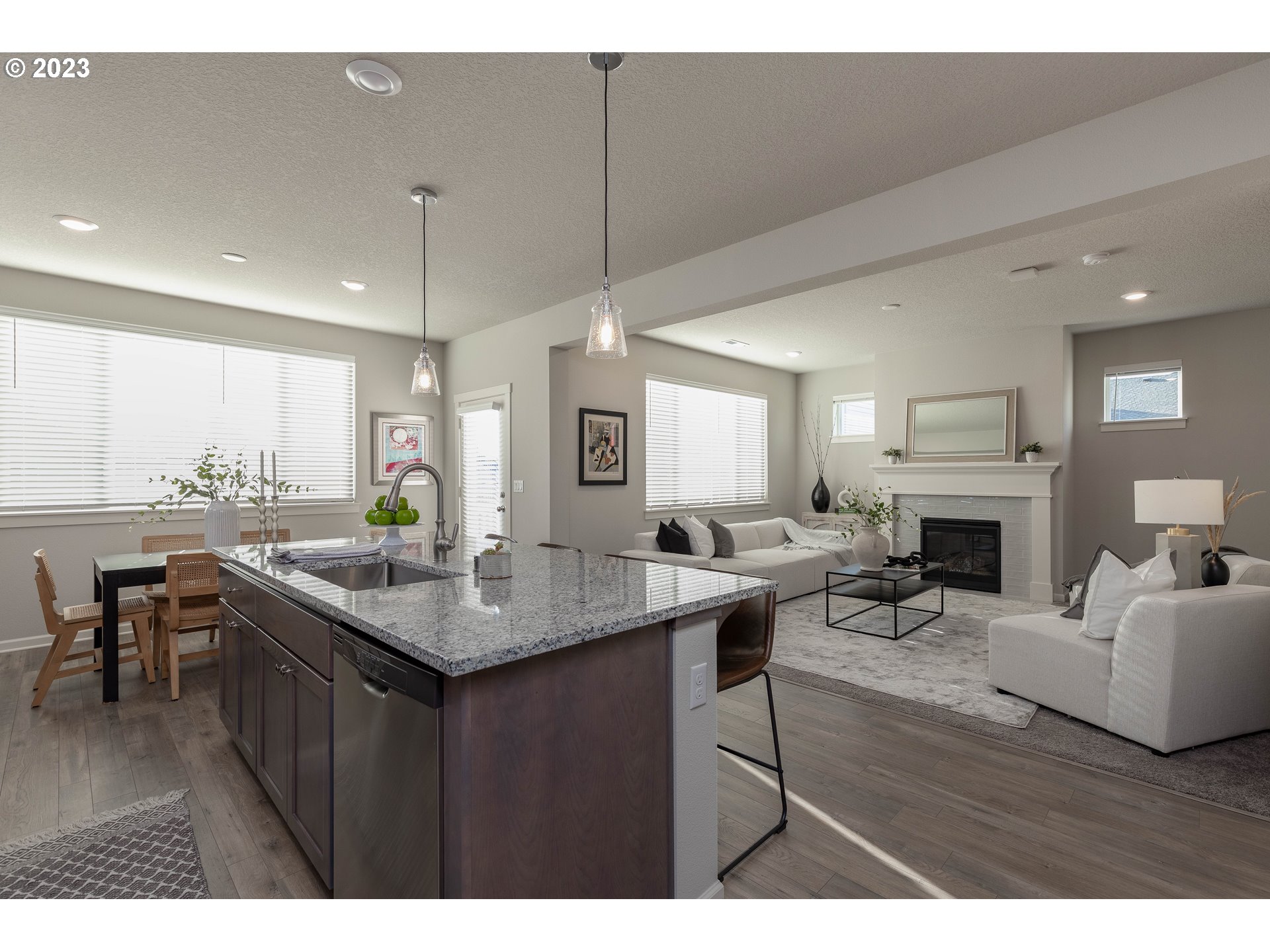 3825 South 39th Place Ridgefield, WA 98642 - Photo 8 of 37 a kitchen with a table chairs and a fireplace