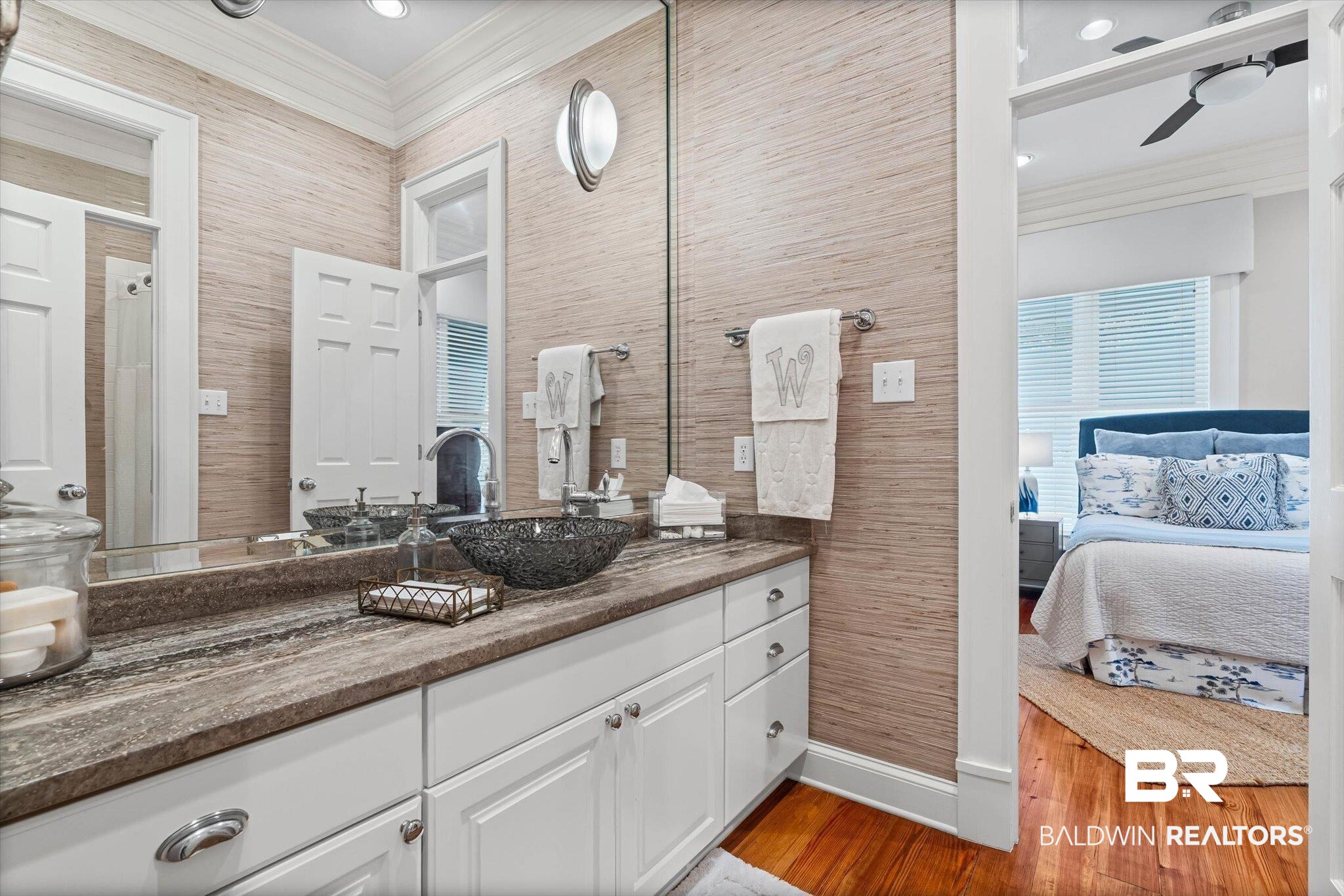 7015 Bay Road Mobile, AL 36605 - Photo 26 of 53 Ensuite bathroom featuring vanity, crown molding, and dark wood-type flooring