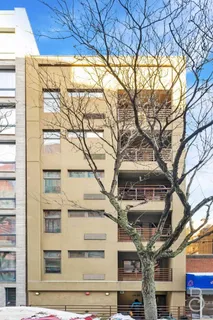 a view of a building with a tree