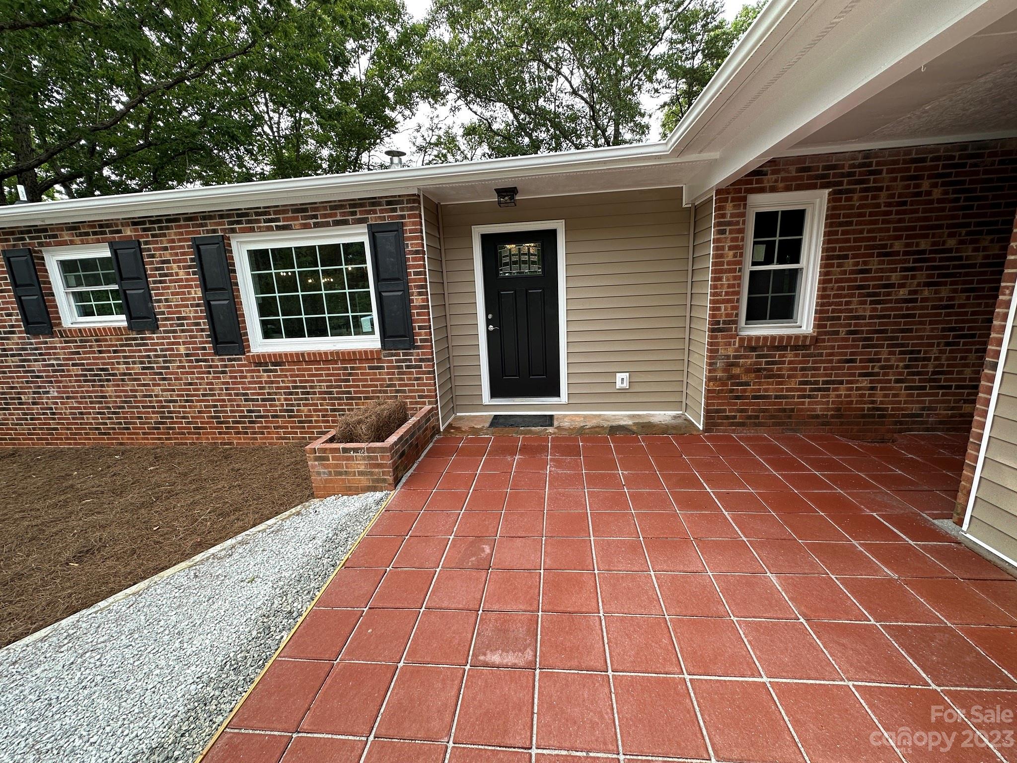 214 Squaw Valley Road Blacksburg, SC 29702 - Photo 5 of 35 a view of a backyard with a white door and wooden floor