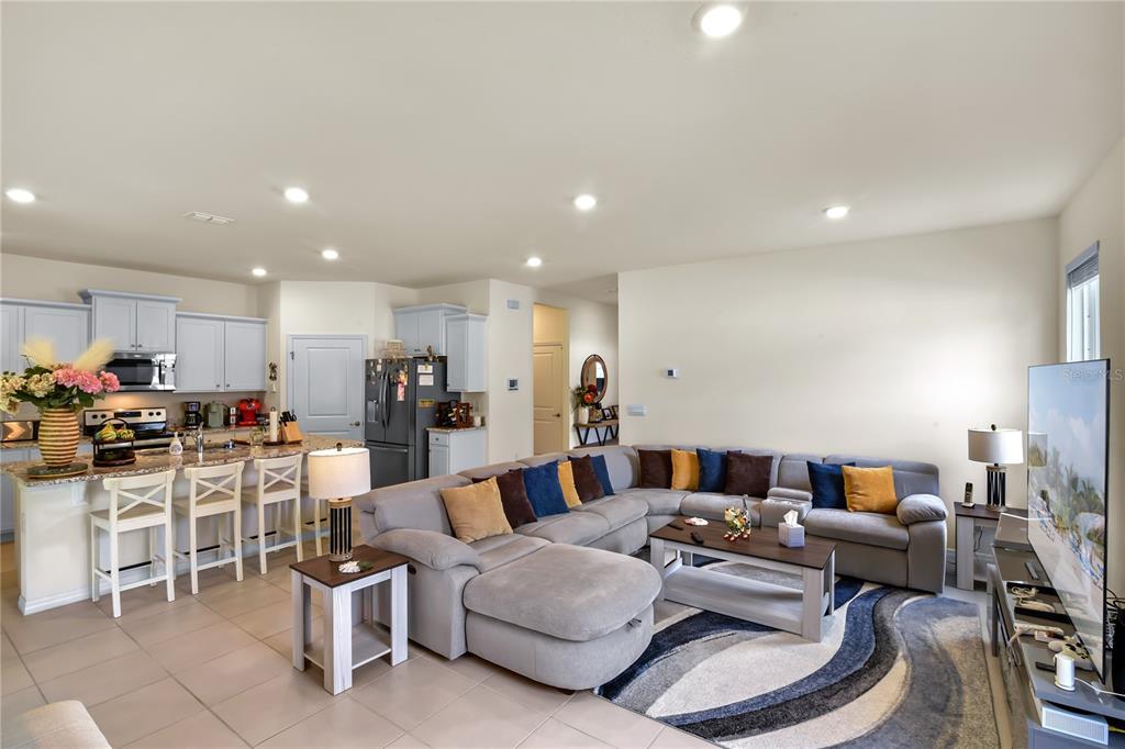 6345 Southwest 88th Loop Ocala, FL 34476 - Photo 12 of 41 a living room with furniture and a view of kitchen