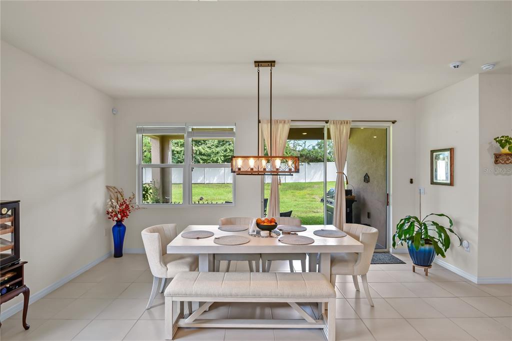 6345 Southwest 88th Loop Ocala, FL 34476 - Photo 13 of 41 a view of a dining room with furniture window and outside view