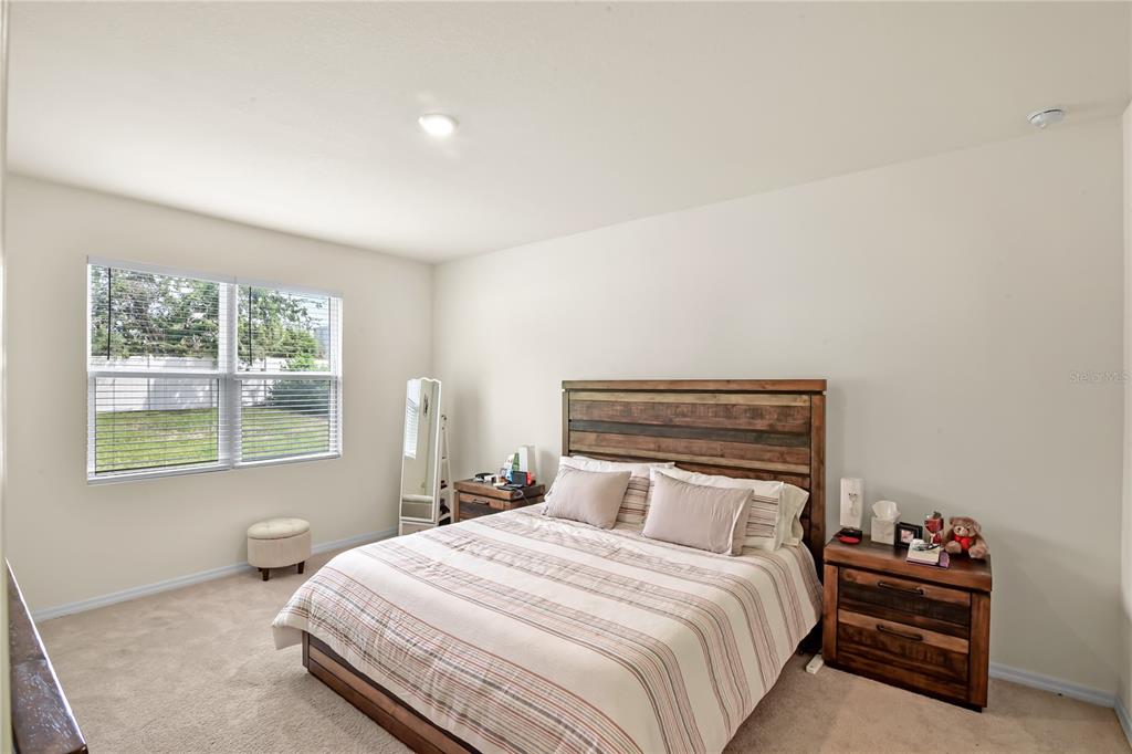 6345 Southwest 88th Loop Ocala, FL 34476 - Photo 25 of 41 a bedroom with a bed and window