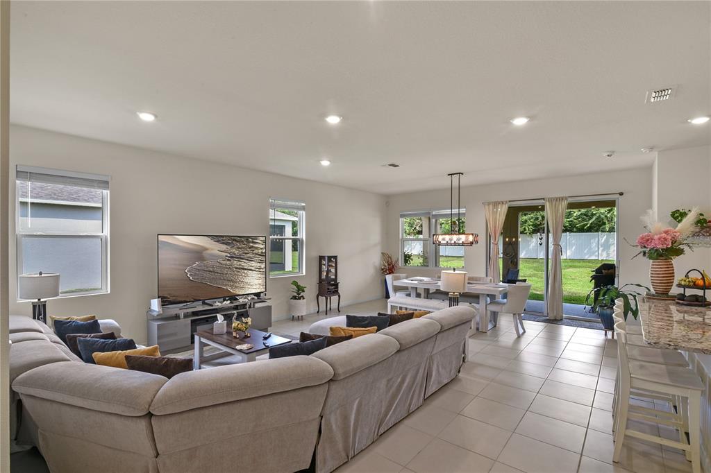 6345 Southwest 88th Loop Ocala, FL 34476 - Photo 10 of 41 a living room with furniture and a large window