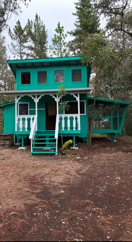 a view of a house with a yard and garage
