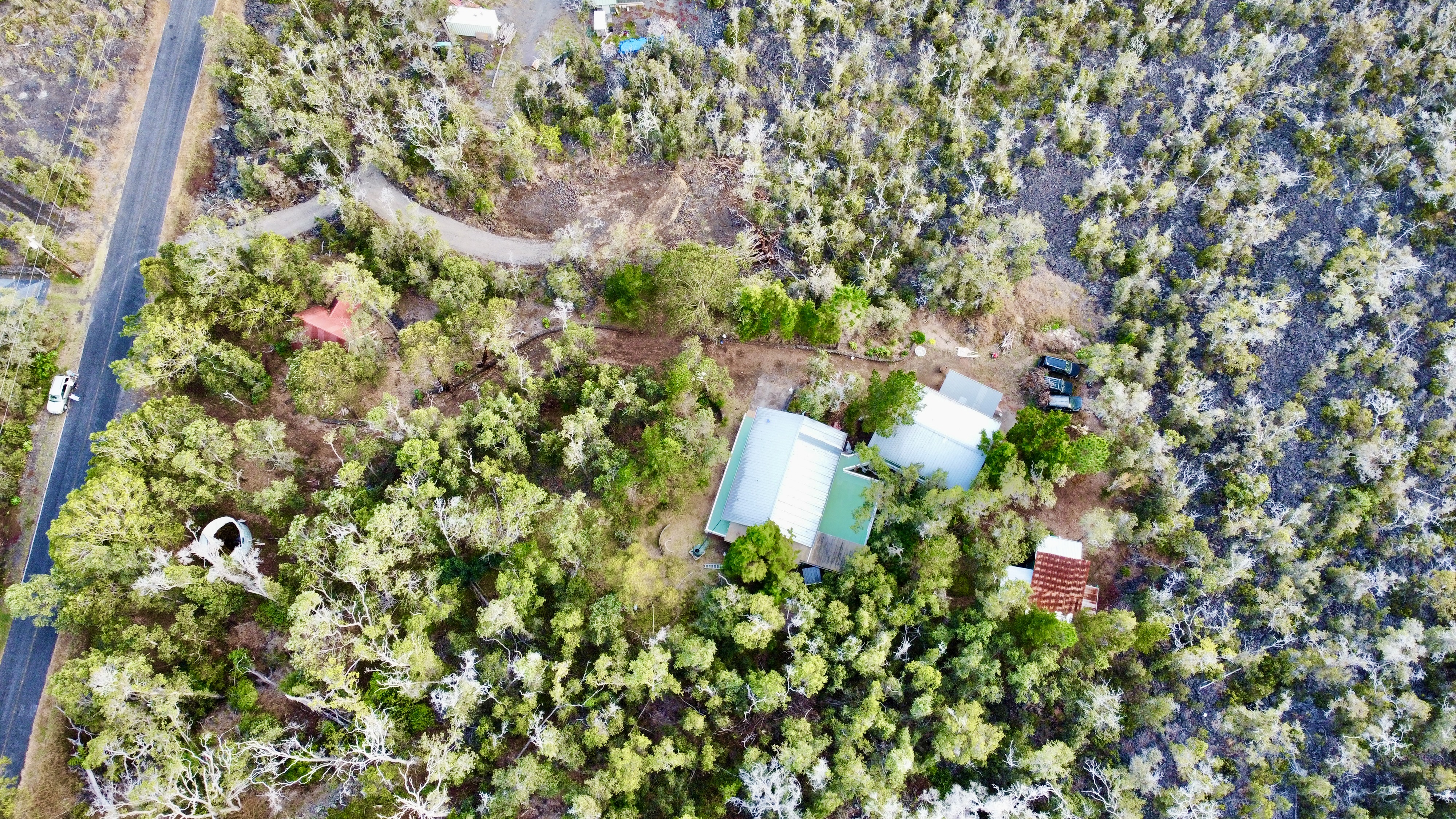 92-8845 Reef Parkway Ocean View, HI 96704 - Photo 21 of 23 a backyard of a house with lots of green space