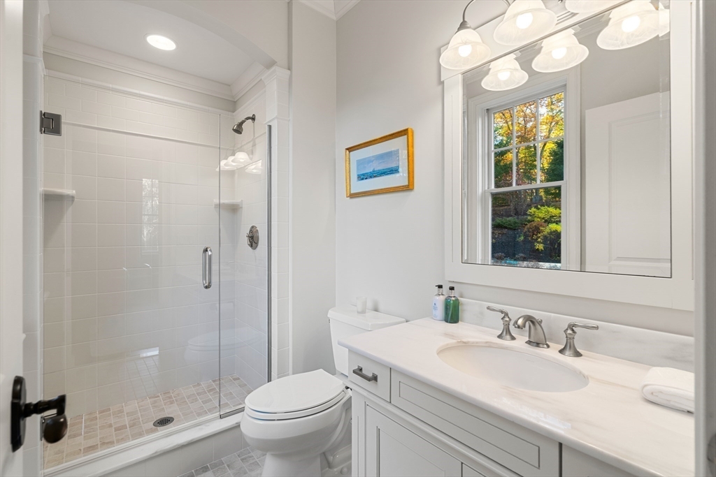 427 B Ipswich Road Boxford, MA 01921 - Photo 12 of 42 a bathroom with a sink a toilet a large mirror and shower
