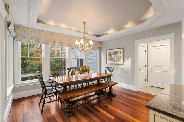 a living room with furniture a window and a chandelier