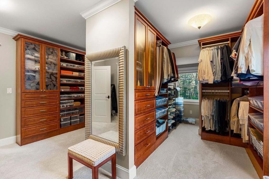 427 B Ipswich Road Boxford, MA 01921 - Photo 27 of 42 a view of walk in closet with clothes and shoes