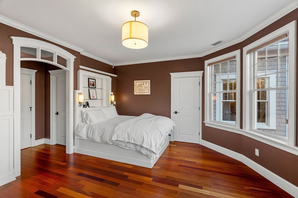 427 B Ipswich Road Boxford, MA 01921 - Photo 30 of 42 a bedroom with a bed and wooden floor