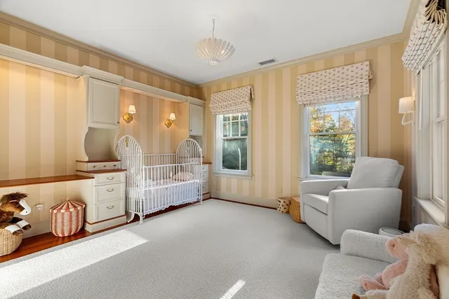 a spacious bedroom with a bed and a couch