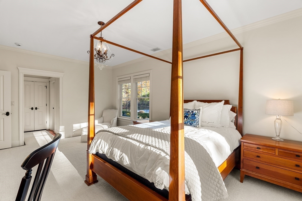 427 B Ipswich Road Boxford, MA 01921 - Photo 35 of 42 a bedroom with a bed and a mirror