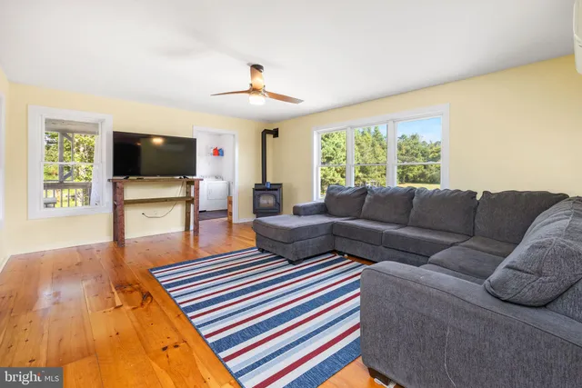 a bedroom with a bed and a view of balcony