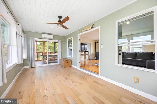 a view of a balcony with wooden floor