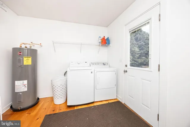 a view of an entryway with wooden floor