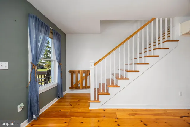 a bed room with a bed and a window