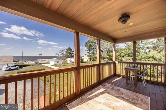 a bathroom with a double vanity sink toilet mirror and shower